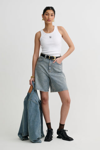 Wide denim shorts styled with a white tank top, Lis Bonne Atelier