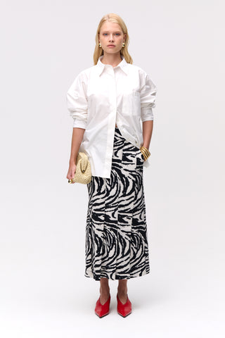 Front view of the white poplin shirt from Lis Bonne Atelier, styled with the Zebra skirt