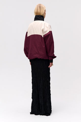 Long, maxi lace dress from Lis Bonne Atelier, styled with a windbreaker