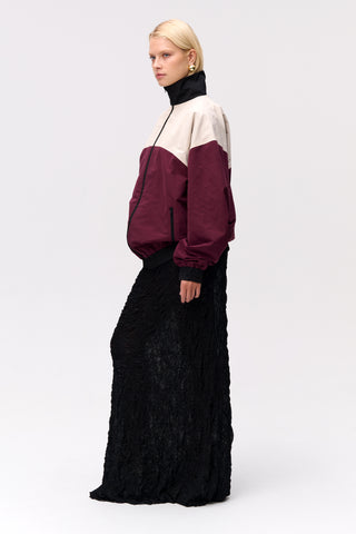 Long, maxi lace dress from Lis Bonne Atelier, styled with a windbreaker