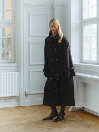 The Lyocell Trenchcoat in black, oversized double-breasted trench coat, campaign image